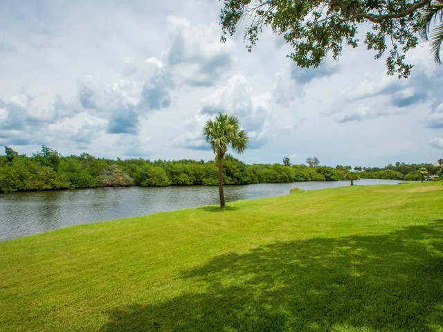 a view of a lake with a big yard