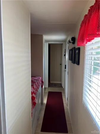 a view of hallway with furniture