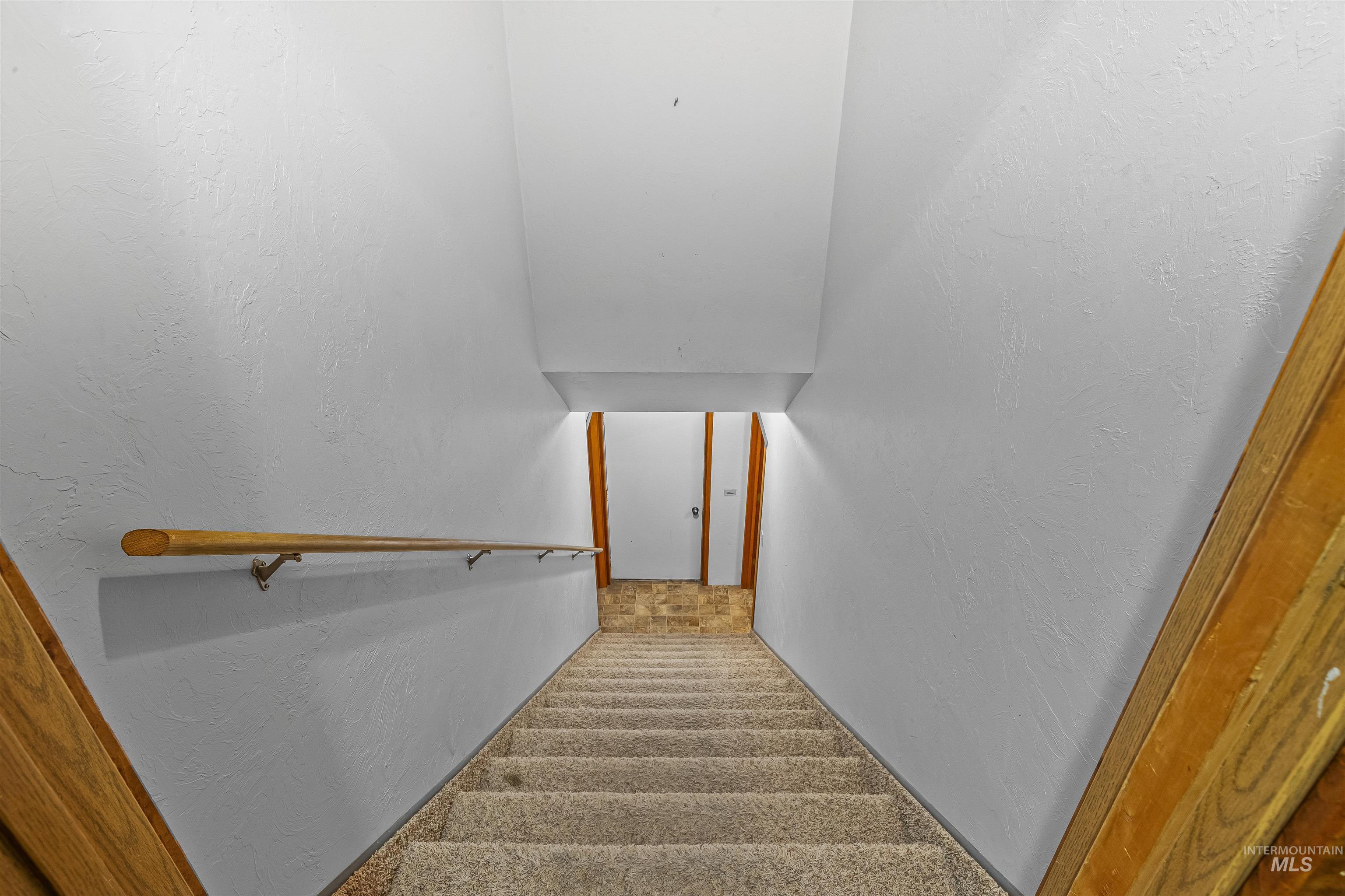 302 Berger Street Riggins, ID 83549 - Photo 13 of 47 Stairway featuring carpet floors
