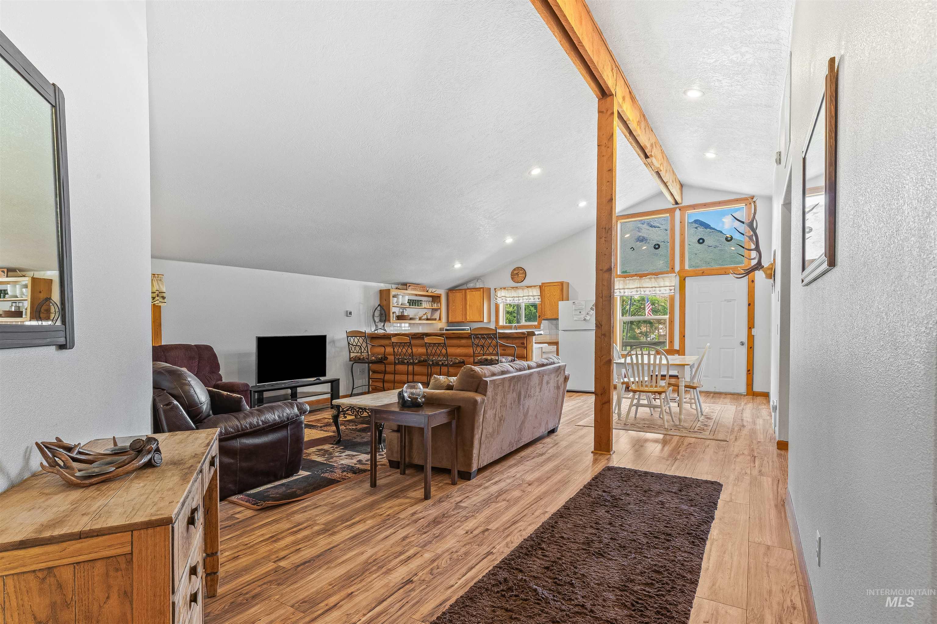 302 Berger Street Riggins, ID 83549 - Photo 19 of 47 Living room with light wood finished floors, a textured wall, and recessed lighting