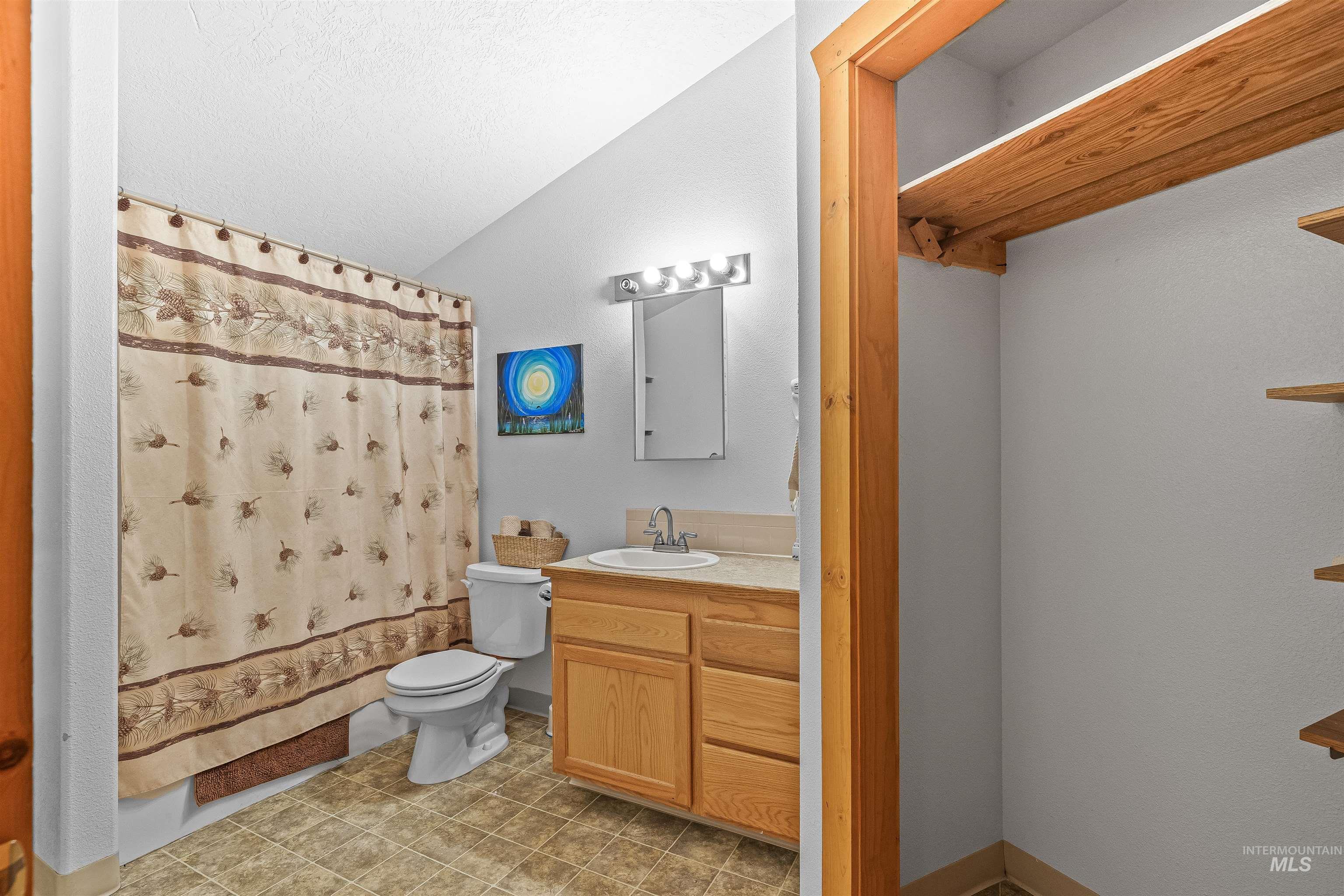 302 Berger Street Riggins, ID 83549 - Photo 25 of 47 Full bath featuring vaulted ceiling and vanity