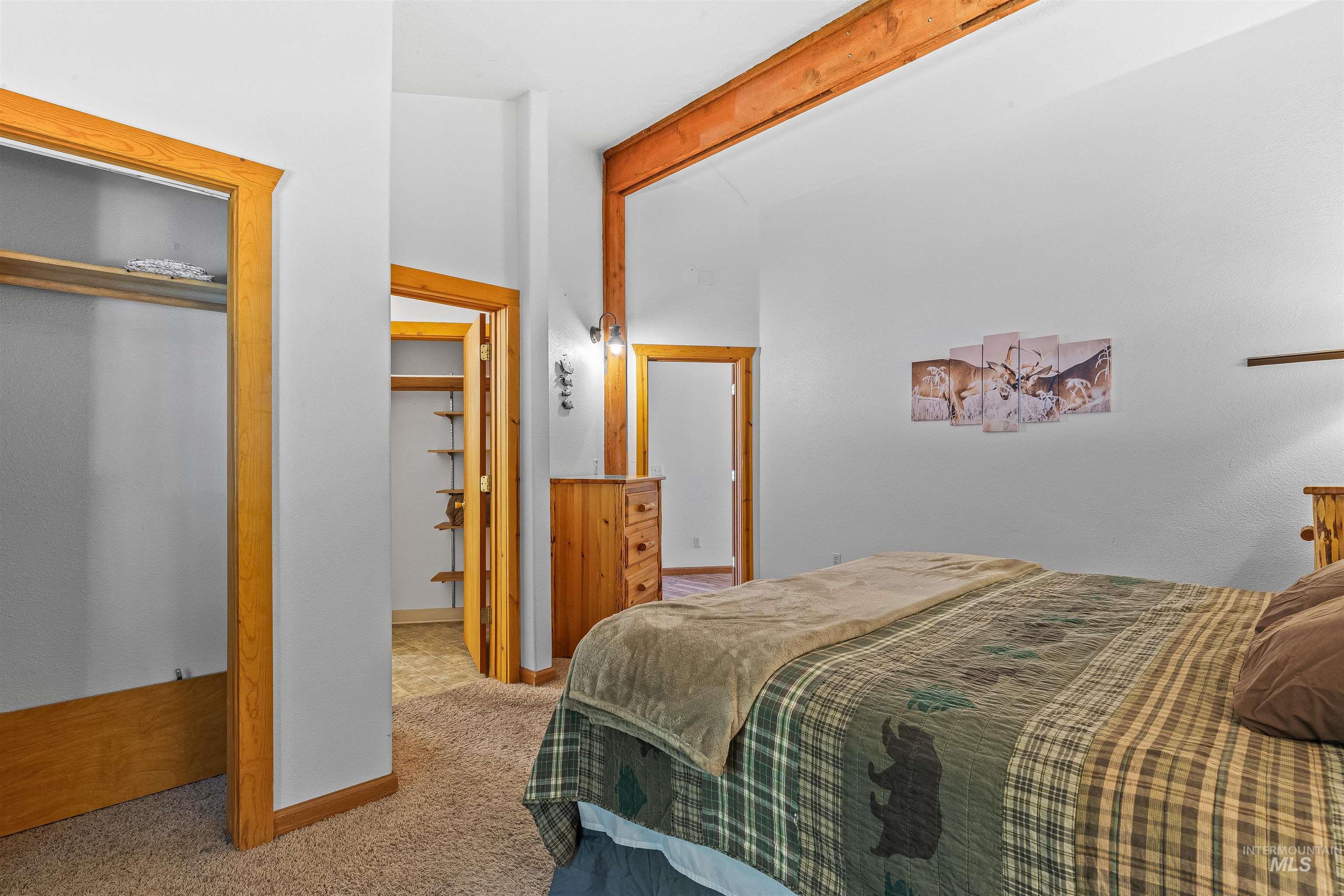 302 Berger Street Riggins, ID 83549 - Photo 26 of 47 Bedroom with carpet, beamed ceiling, and a closet