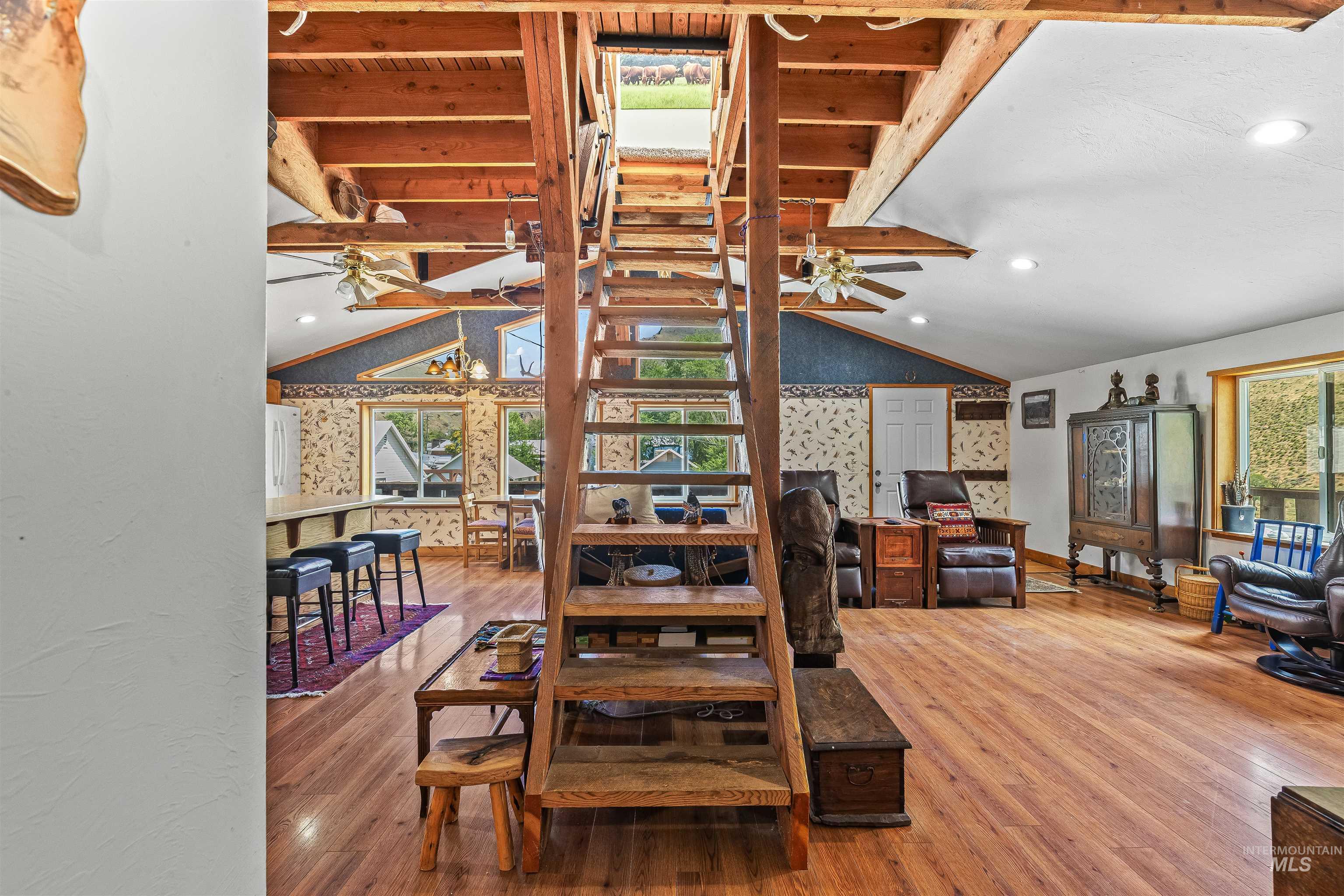 302 Berger Street Riggins, ID 83549 - Photo 7 of 47 Dining room featuring a ceiling fan, wood finished floors, stairs, and recessed lighting