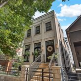 a view of a building with a tree
