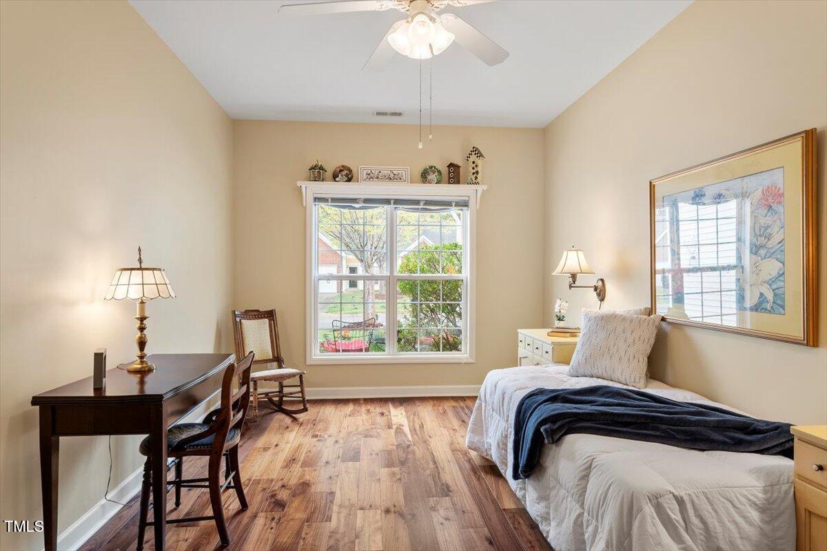 2524 Forest Shadows Lane Raleigh, NC 27614 - Photo 21 of 48 a bedroom with a bed and a window