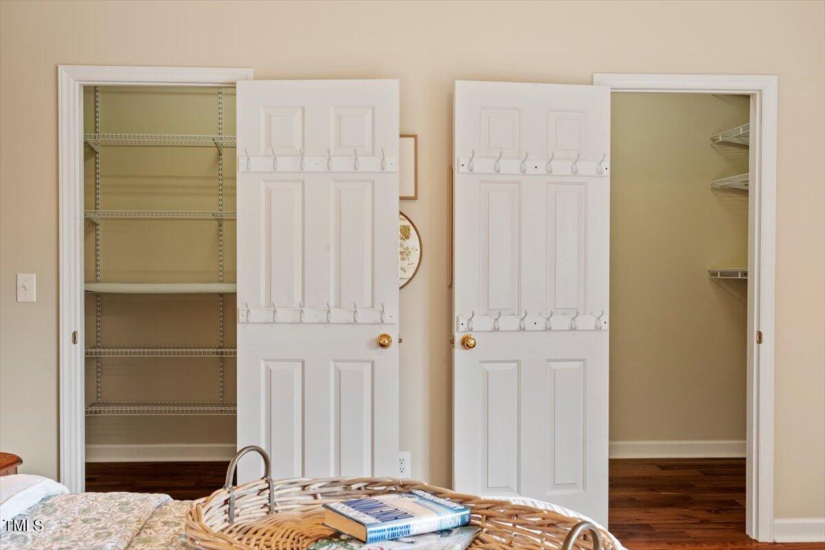 2524 Forest Shadows Lane Raleigh, NC 27614 - Photo 28 of 48 a bedroom with a bed and a table