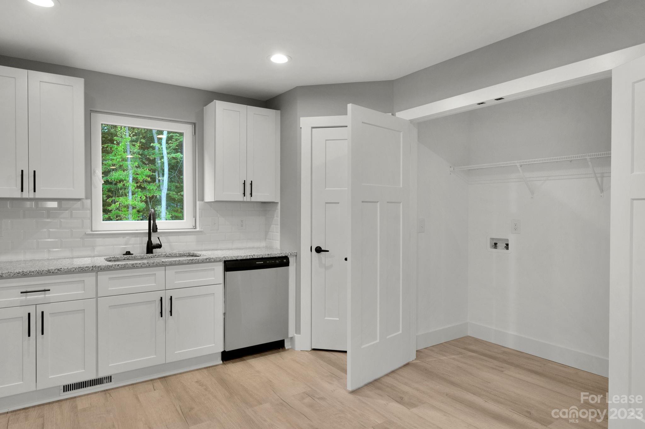 385 Roper Drive Lincolnton, NC 28092 - Photo 3 of 13 a kitchen with a sink and cabinets