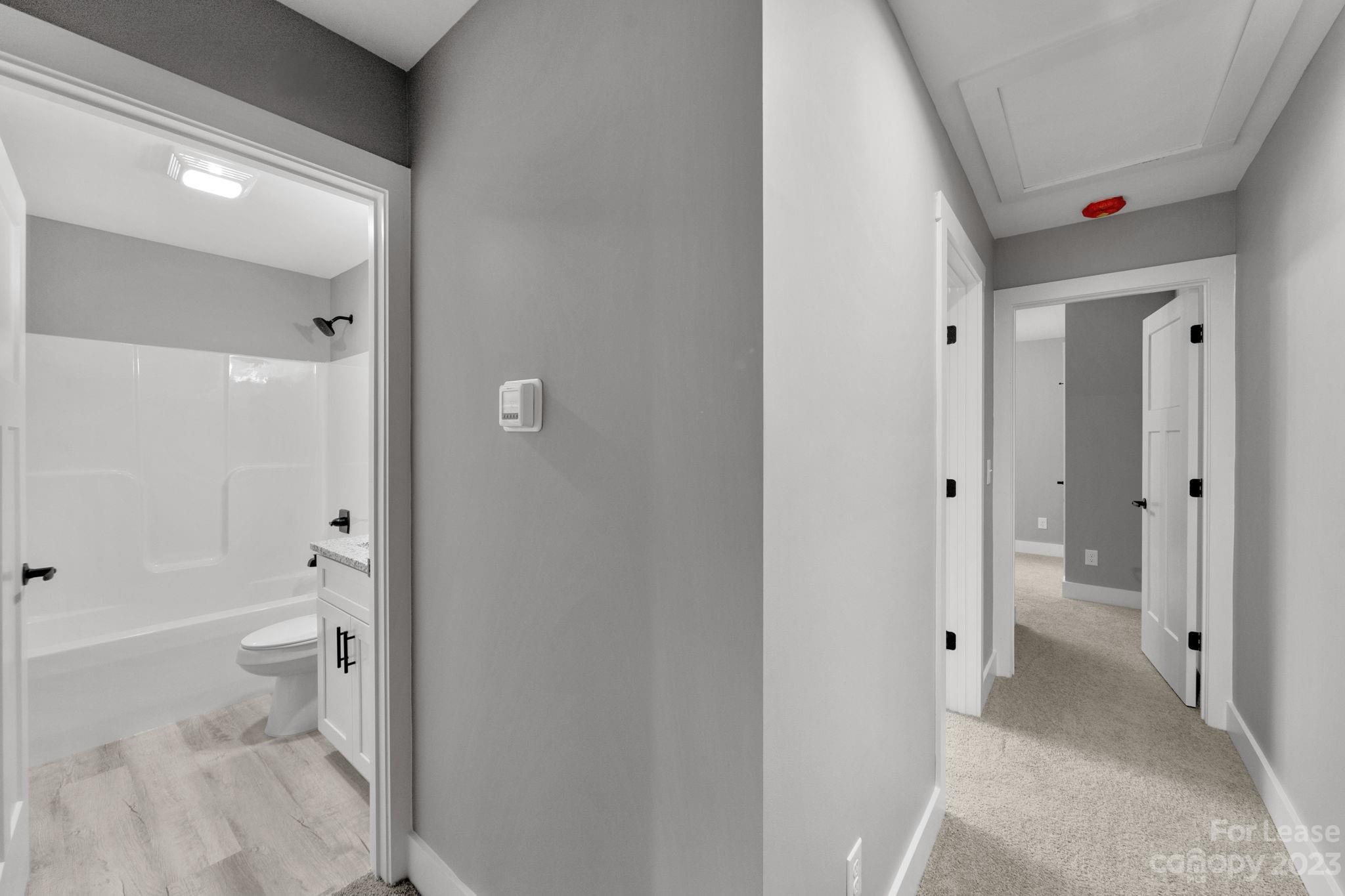 385 Roper Drive Lincolnton, NC 28092 - Photo 8 of 13 a bathroom with a shower and a toilet
