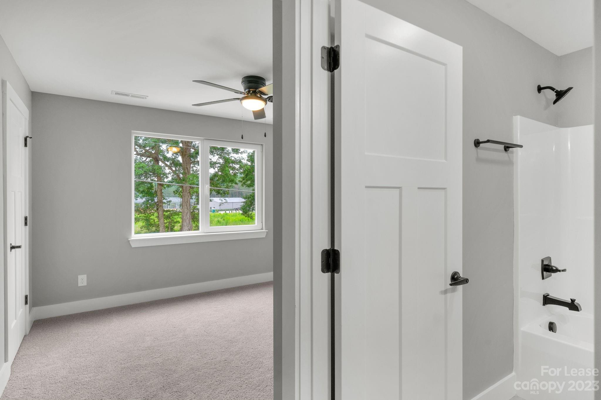 385 Roper Drive Lincolnton, NC 28092 - Photo 10 of 13 a view of an empty room with a window