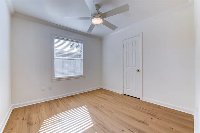 a bedroom with bed and a window