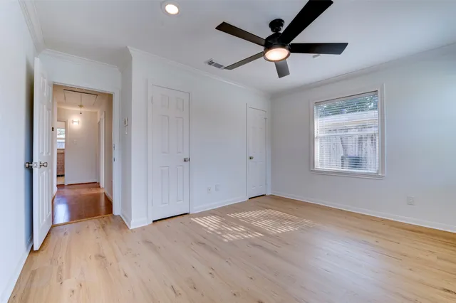 a bed room with a bed and a window