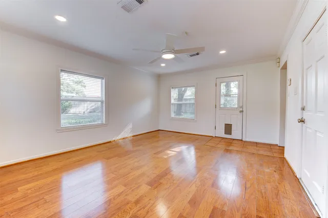 a kitchen with stainless steel appliances white cabinets and a refrigerator