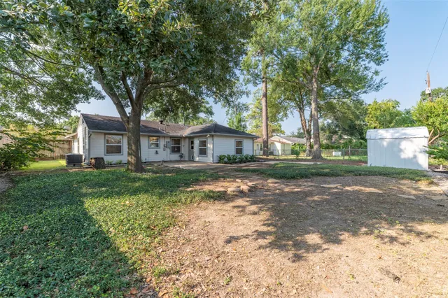 a view of a dining room with furniture and window