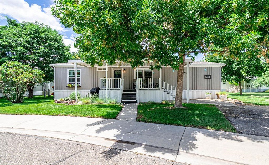 435 32 Road, Unit 601 Clifton, CO 81520 - Photo 1 of 26 a front view of a house with a garden