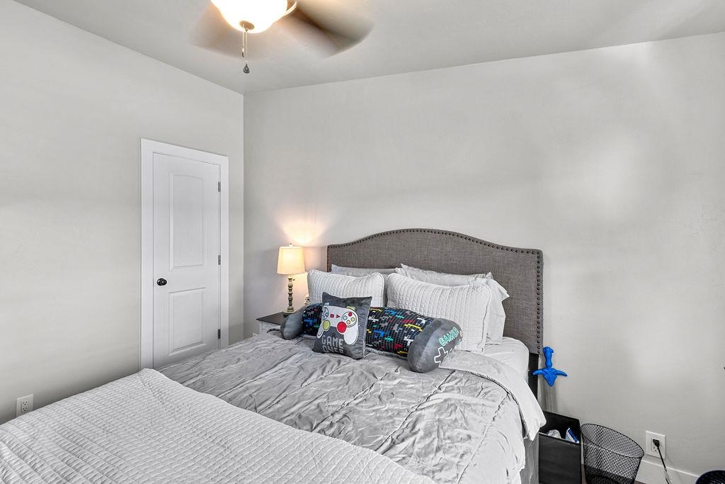 435 32 Road, Unit 601 Clifton, CO 81520 - Photo 19 of 26 a bed room with a bed and a night stand