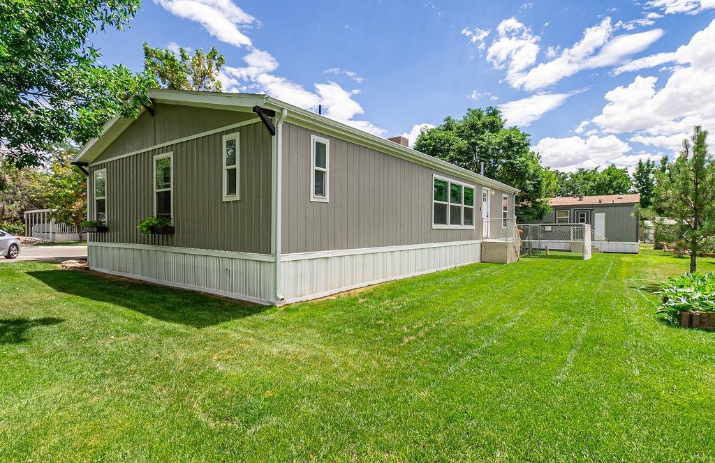435 32 Road, Unit 601 Clifton, CO 81520 - Photo 21 of 26 a view of a house with a yard