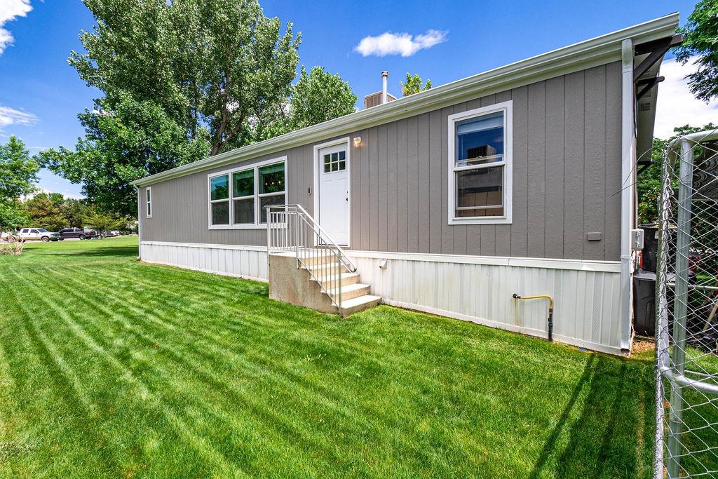 435 32 Road, Unit 601 Clifton, CO 81520 - Photo 22 of 26 a front view of house with yard and green space