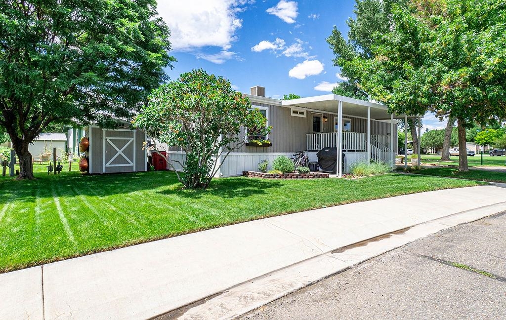 435 32 Road, Unit 601 Clifton, CO 81520 - Photo 25 of 26 a front view of house with garden