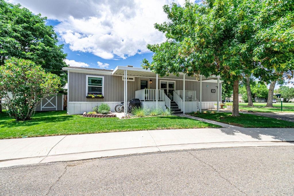 435 32 Road, Unit 601 Clifton, CO 81520 - Photo 26 of 26 a front view of house with yard and green space