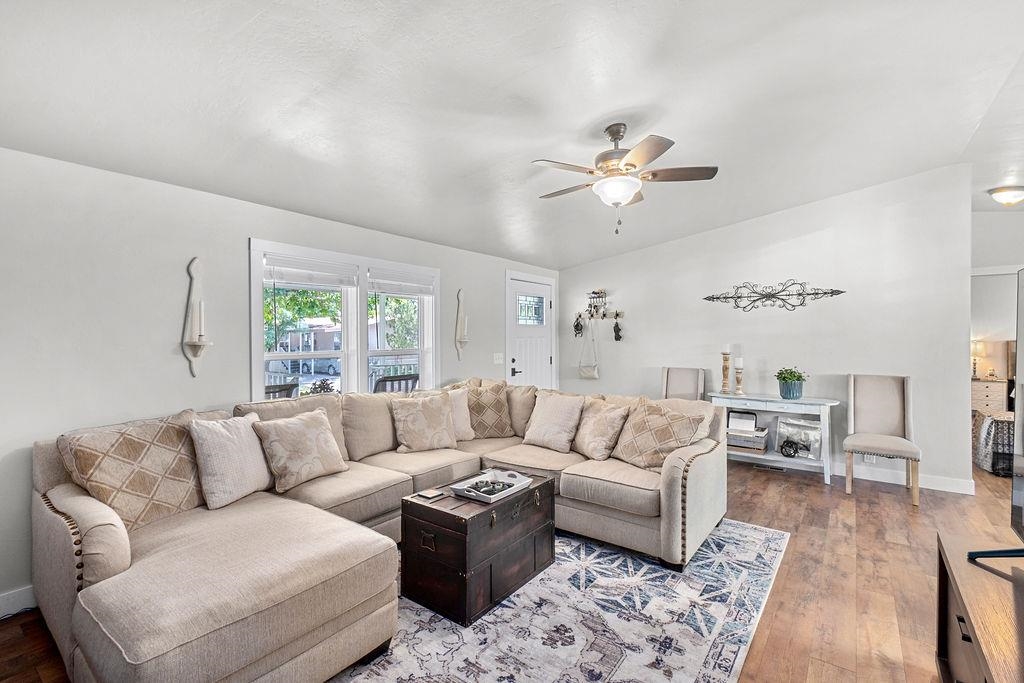 435 32 Road, Unit 601 Clifton, CO 81520 - Photo 4 of 26 a living room with furniture a ceiling fan and a window
