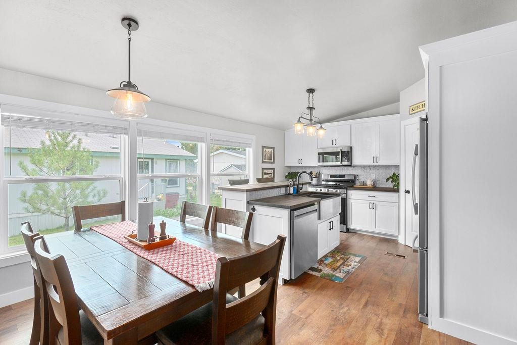 435 32 Road, Unit 601 Clifton, CO 81520 - Photo 6 of 26 a kitchen with a dining table chairs and refrigerator