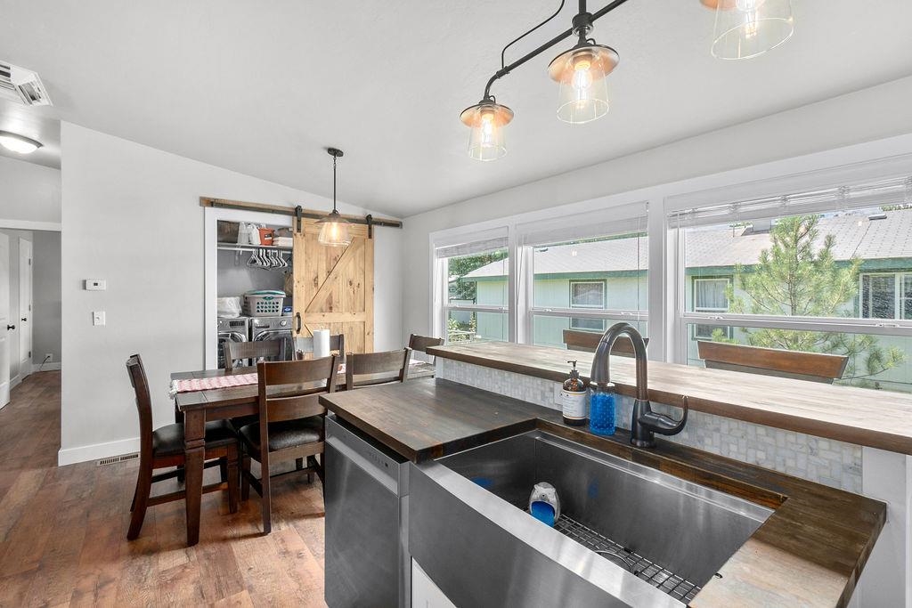 435 32 Road, Unit 601 Clifton, CO 81520 - Photo 8 of 26 a kitchen with a stove a sink and living room view