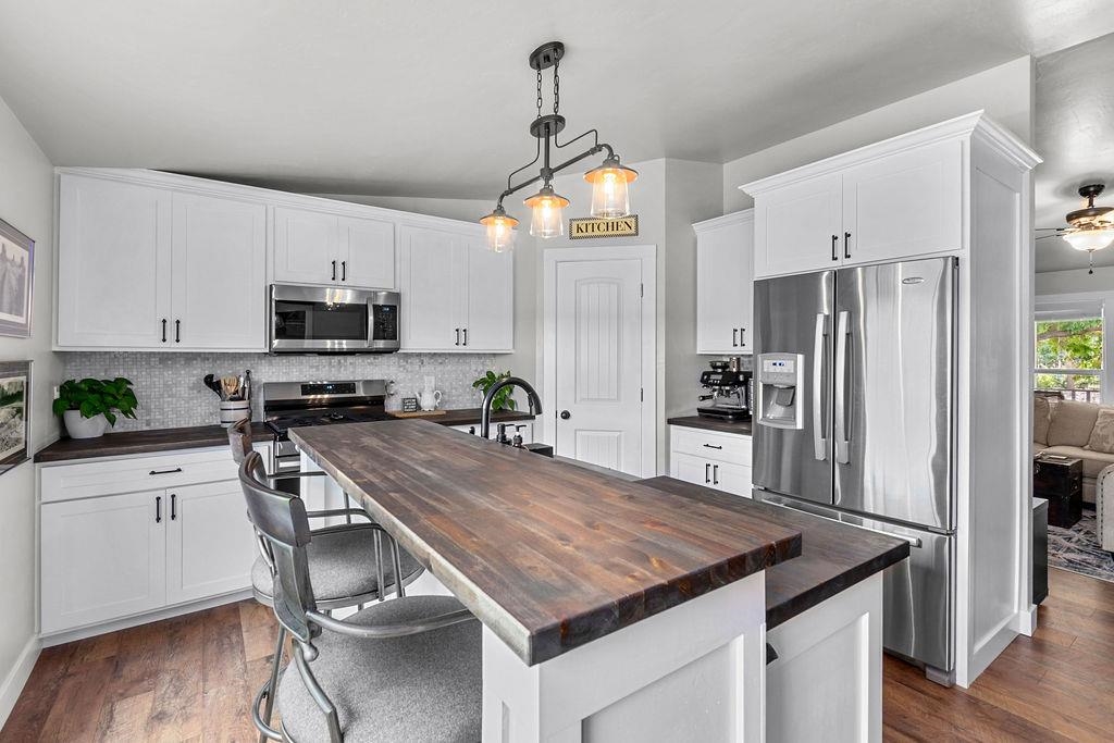 435 32 Road, Unit 601 Clifton, CO 81520 - Photo 9 of 26 a kitchen with kitchen island white cabinets and stainless steel appliances