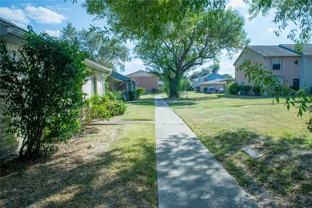 front view of a house with potted plants