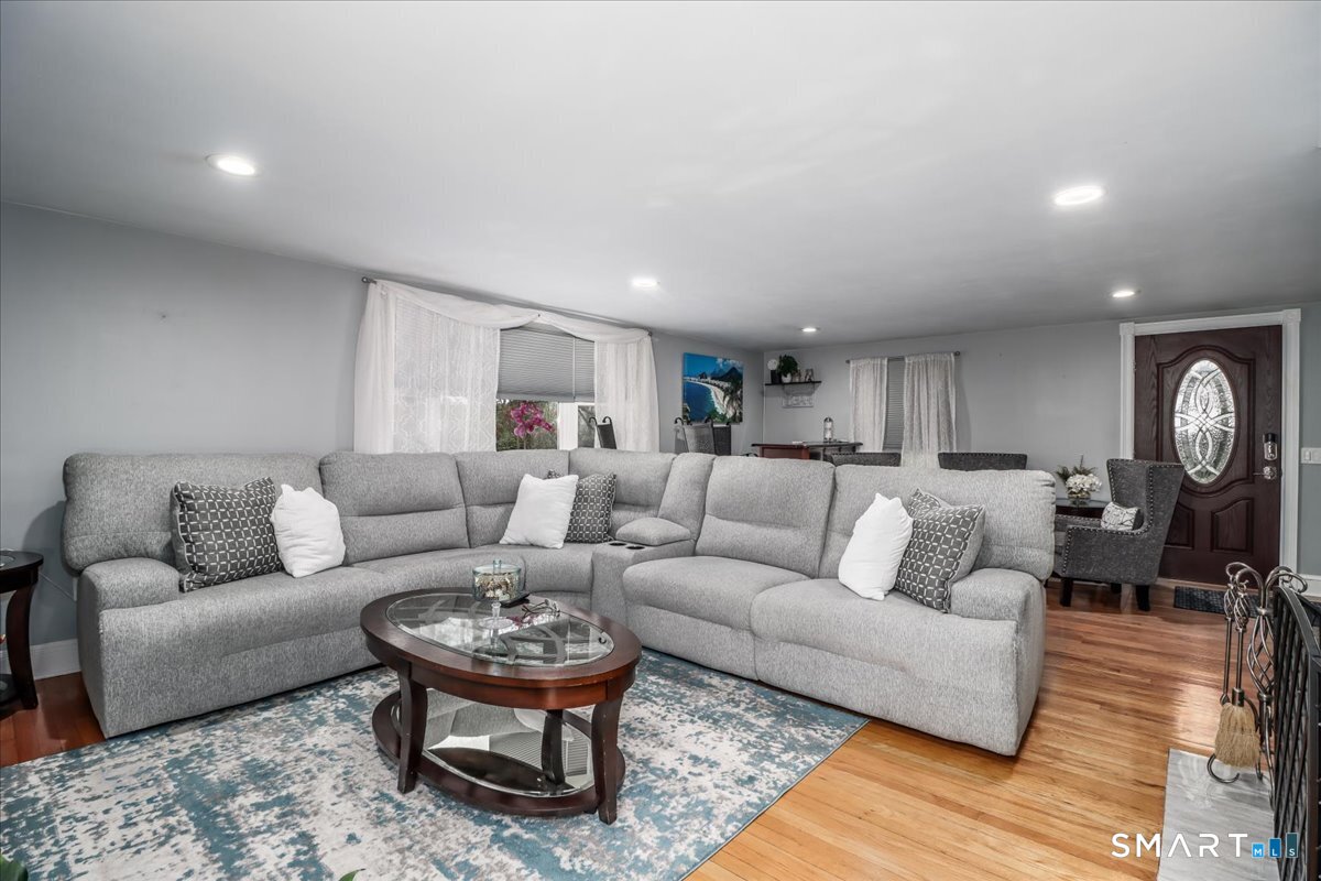 4 Farrell Road Newtown, CT 06470 - Photo 3 of 36 a living room with furniture a rug and a table