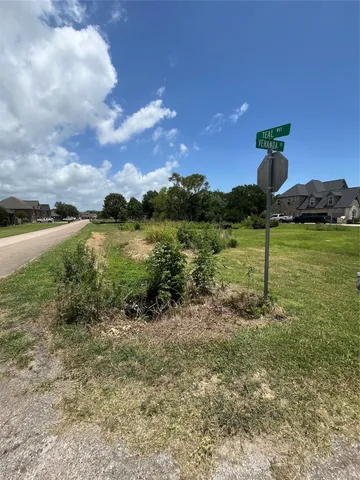 a view of a garden with a building