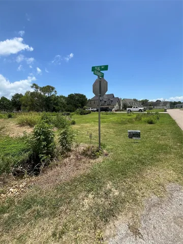 a view of a lake with a yard