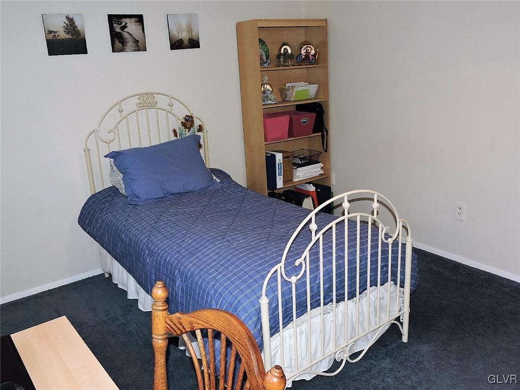 621 Long Mountain Road Effort, PA 18330 - Photo 15 of 22 a bedroom with furniture and a book shelf
