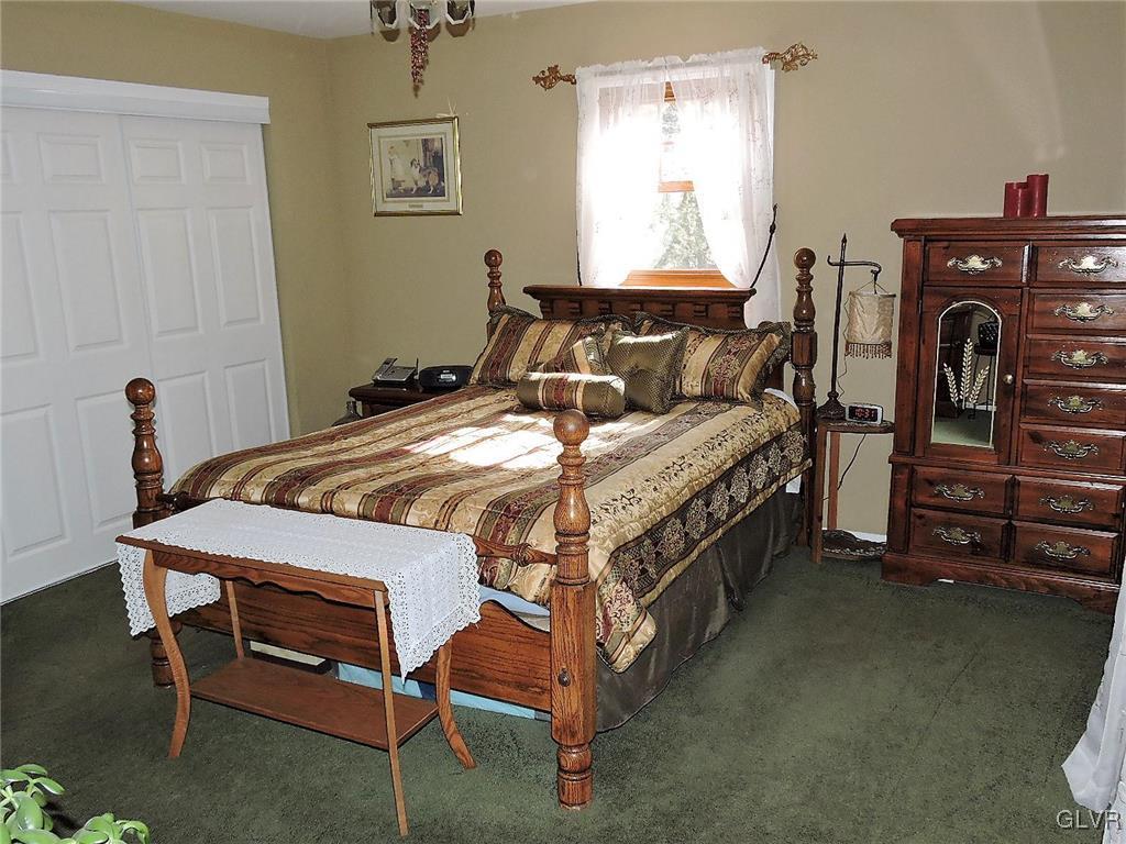 621 Long Mountain Road Effort, PA 18330 - Photo 17 of 22 a bedroom with a bed and a table