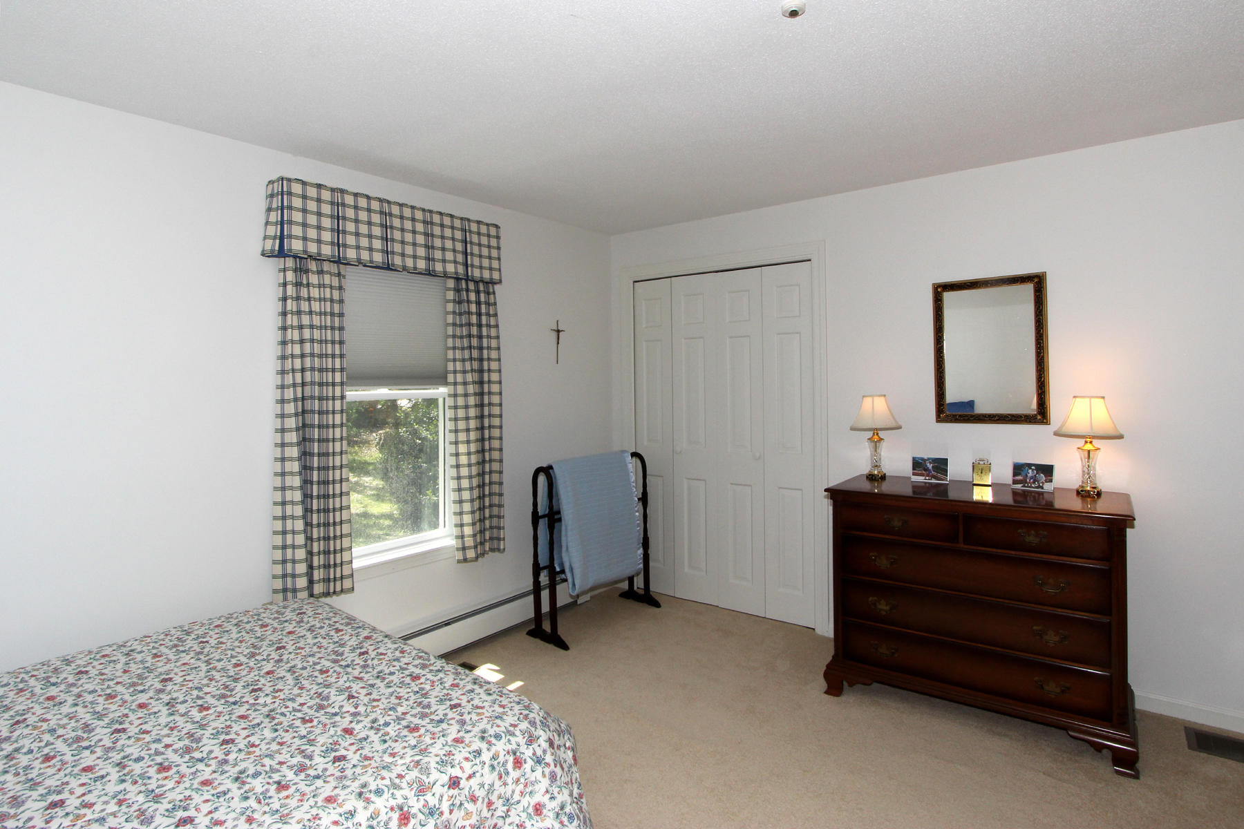 167 Ambergris Circle Brewster, MA 02631 - Photo 17 of 28 a bedroom with a bed and a window