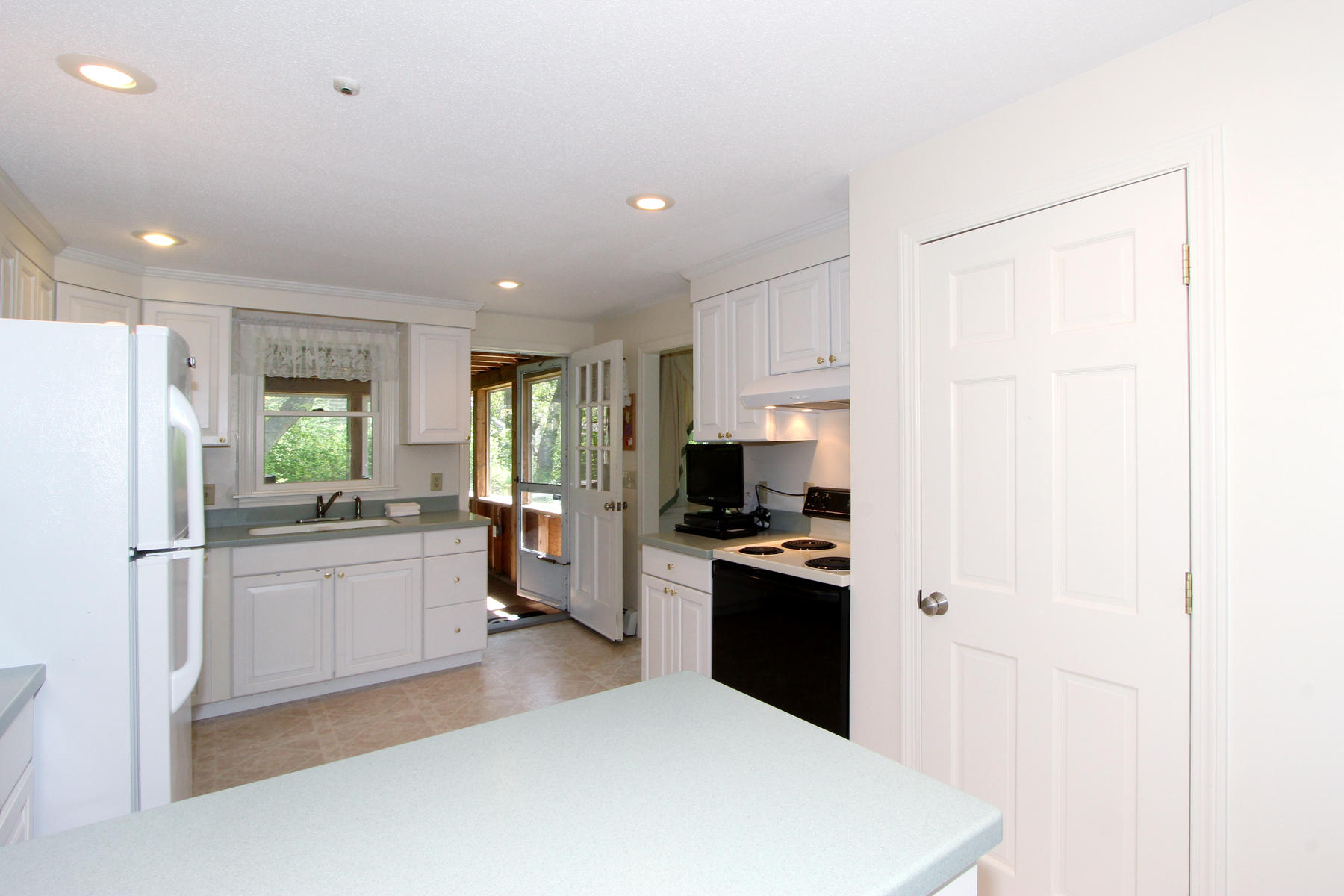 167 Ambergris Circle Brewster, MA 02631 - Photo 7 of 28 a kitchen with stainless steel appliances a refrigerator stove and sink