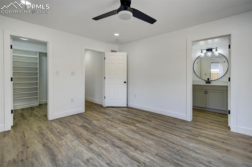 1436 Brewery Road Pueblo, CO 81001 - Photo 18 of 40 Washroom featuring baseboards, wood finished floors, laundry area, and hookup for a washing machine