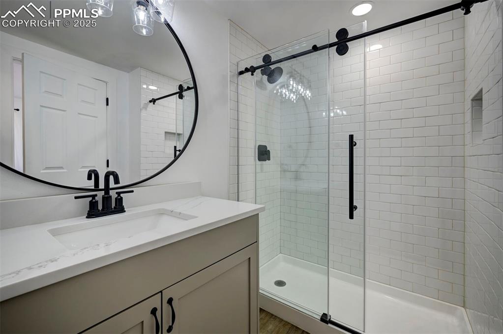 1436 Brewery Road Pueblo, CO 81001 - Photo 22 of 40 Full bathroom featuring vanity and a shower stall