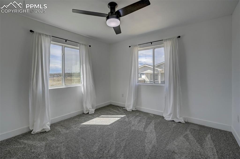 1436 Brewery Road Pueblo, CO 81001 - Photo 28 of 40 Carpeted empty room with a ceiling fan and baseboards
