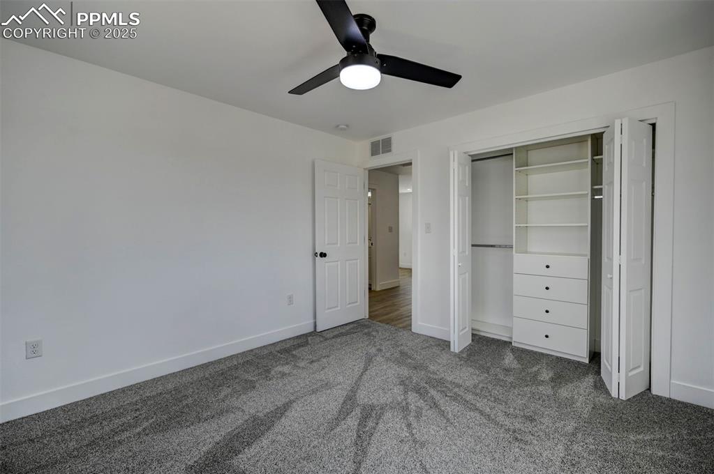 1436 Brewery Road Pueblo, CO 81001 - Photo 30 of 40 Unfurnished bedroom featuring a closet, visible vents, carpet, baseboards, and a ceiling fan