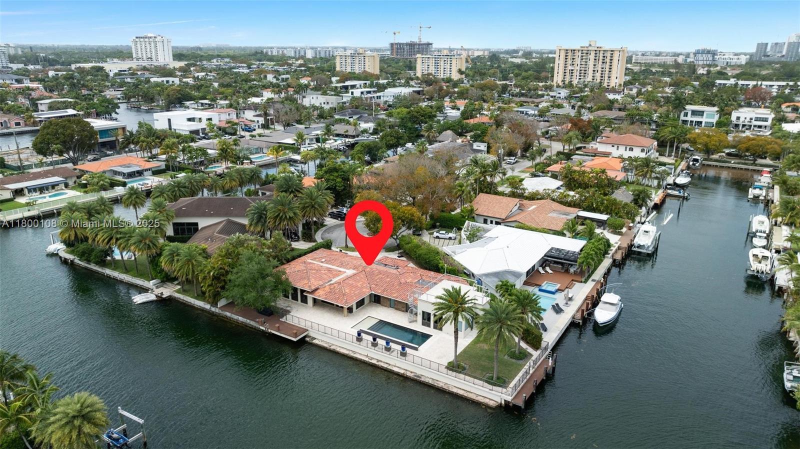 12605 Cyprus Road North Miami, FL 33181 - Photo 1 of 60 an aerial view of residential houses with outdoor space and lake view