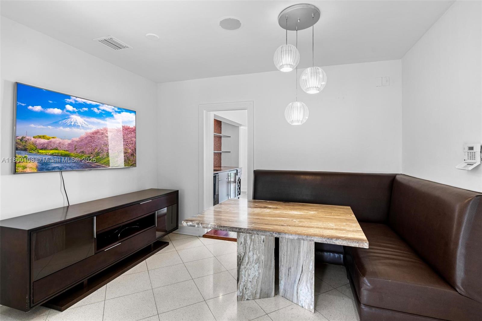 12605 Cyprus Road North Miami, FL 33181 - Photo 15 of 60 a view of a livingroom with furniture and a flat screen tv