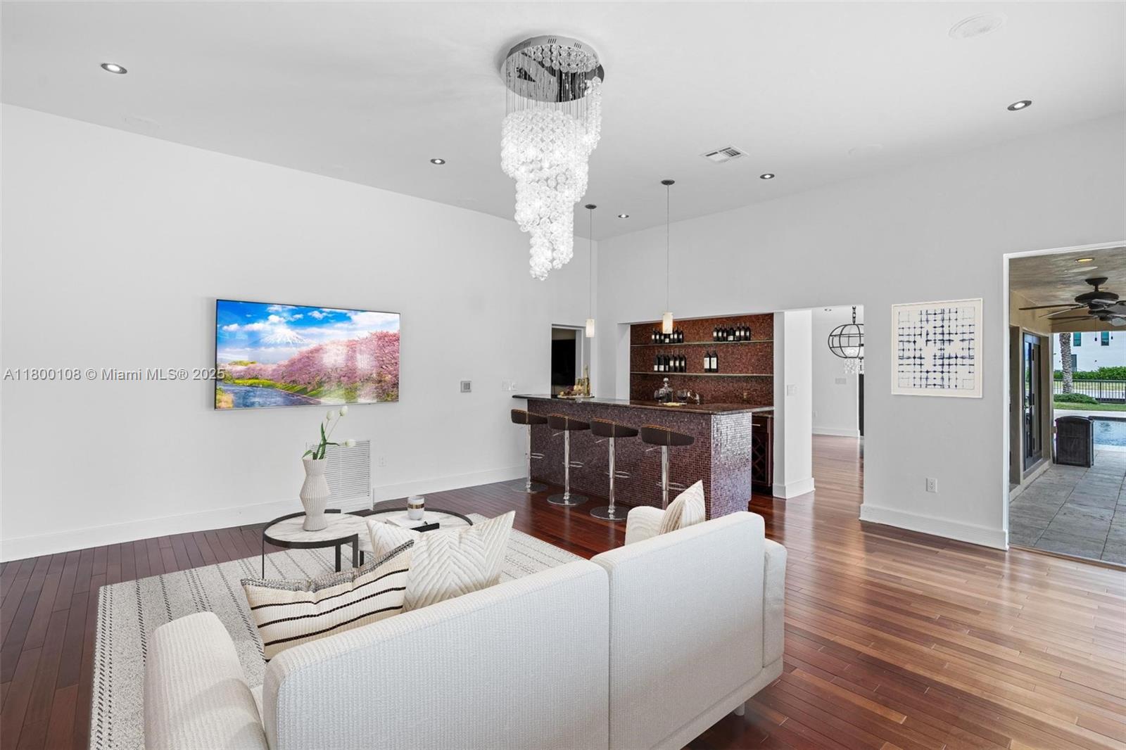 12605 Cyprus Road North Miami, FL 33181 - Photo 19 of 60 a living room with furniture and a flat screen tv