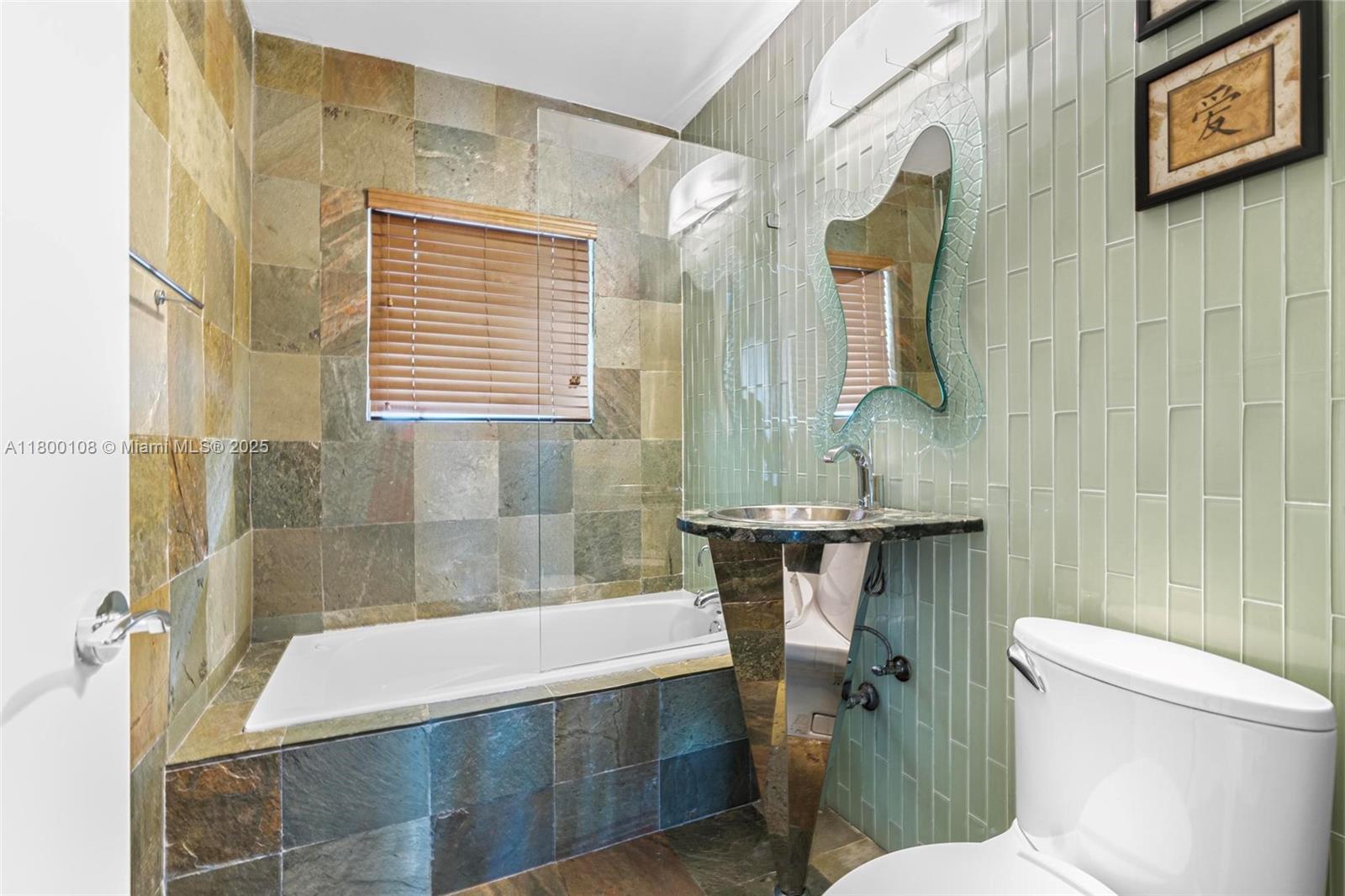 12605 Cyprus Road North Miami, FL 33181 - Photo 21 of 60 a bathroom with a sink and a mirror