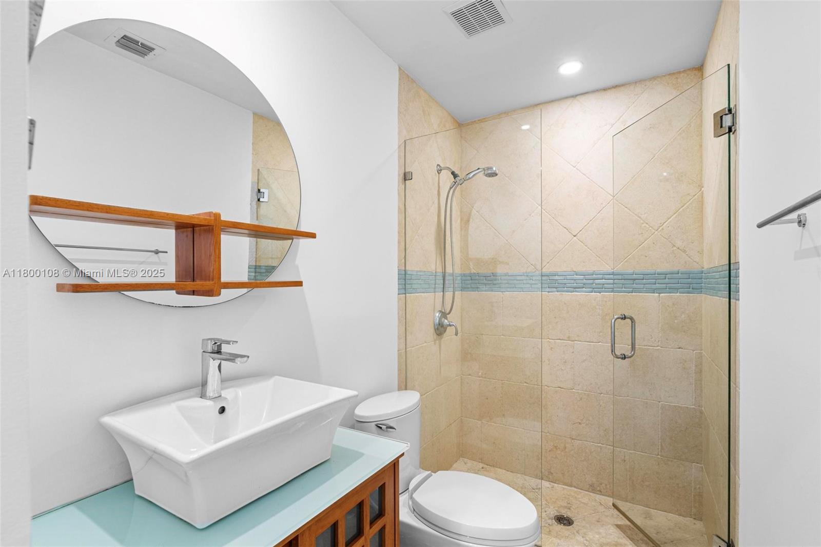 12605 Cyprus Road North Miami, FL 33181 - Photo 24 of 60 a bathroom with a sink mirror and toilet