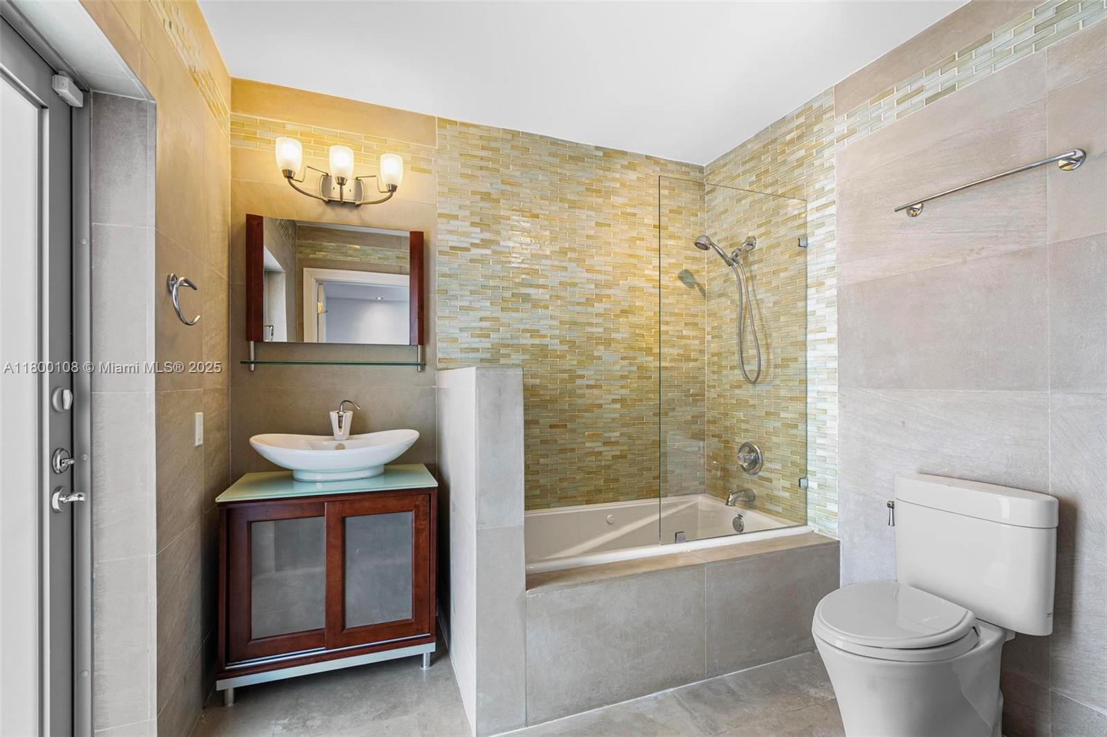 12605 Cyprus Road North Miami, FL 33181 - Photo 26 of 60 a bathroom with a sink a toilet and bathtub