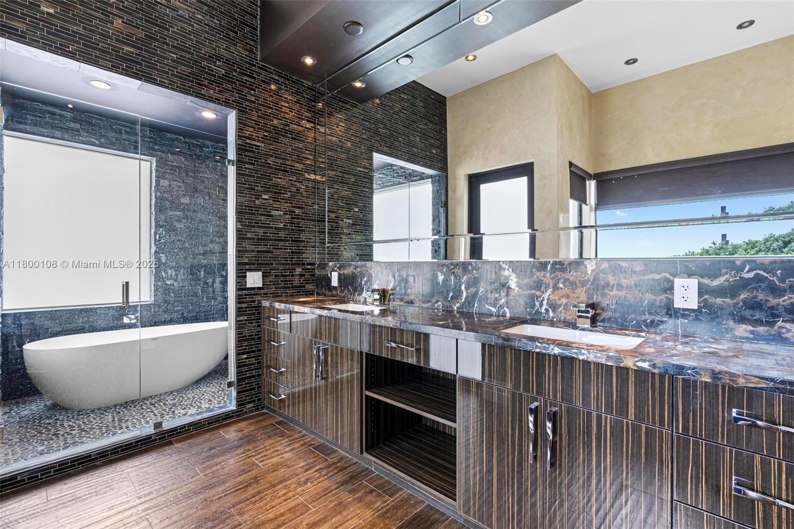 12605 Cyprus Road North Miami, FL 33181 - Photo 31 of 60 a bathroom with a granite countertop sink and a mirror