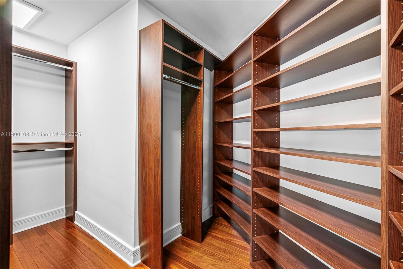 12605 Cyprus Road North Miami, FL 33181 - Photo 34 of 60 a view of walk in closet with empty racks