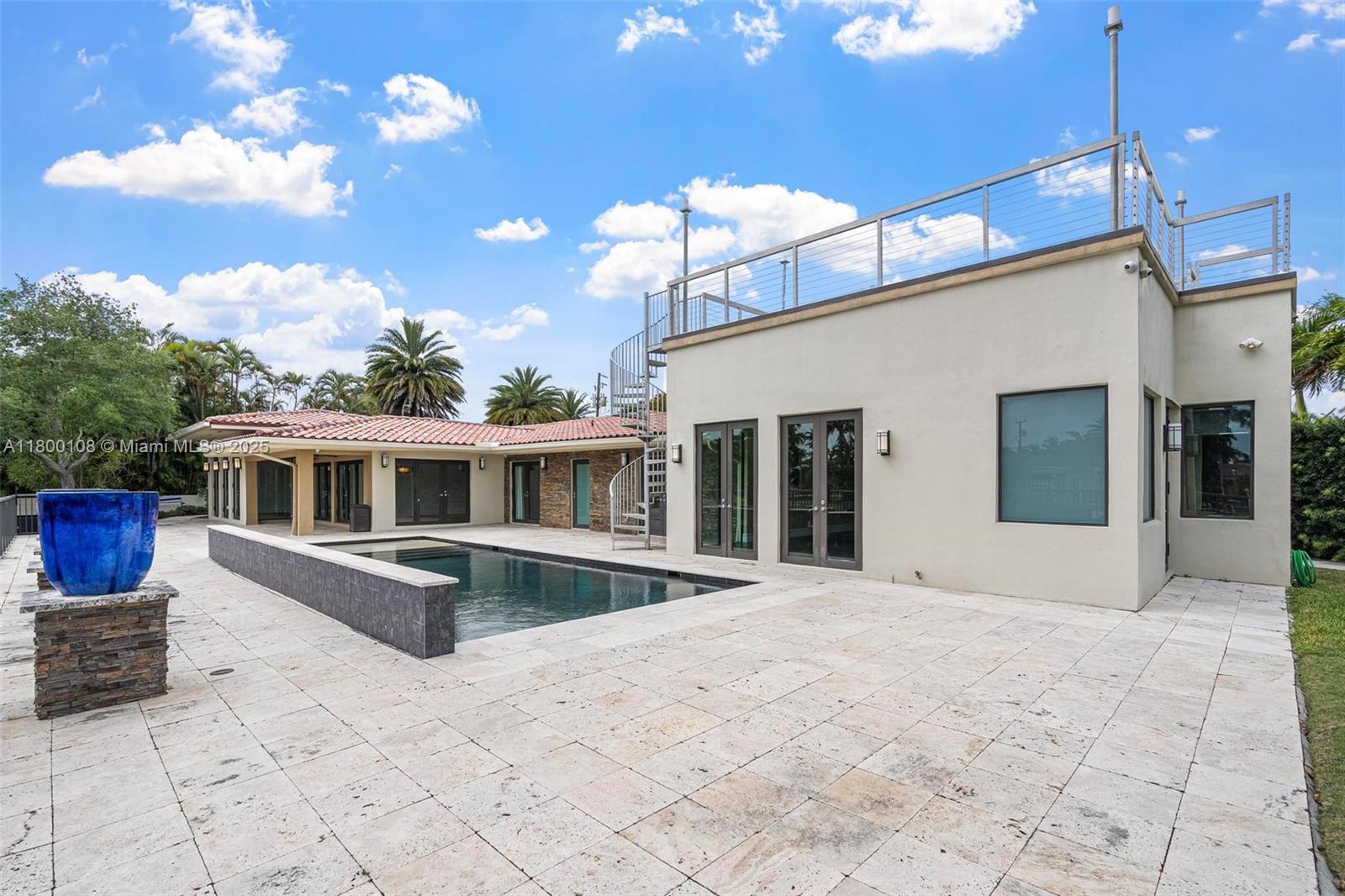 12605 Cyprus Road North Miami, FL 33181 - Photo 38 of 60 a view of a house with a patio
