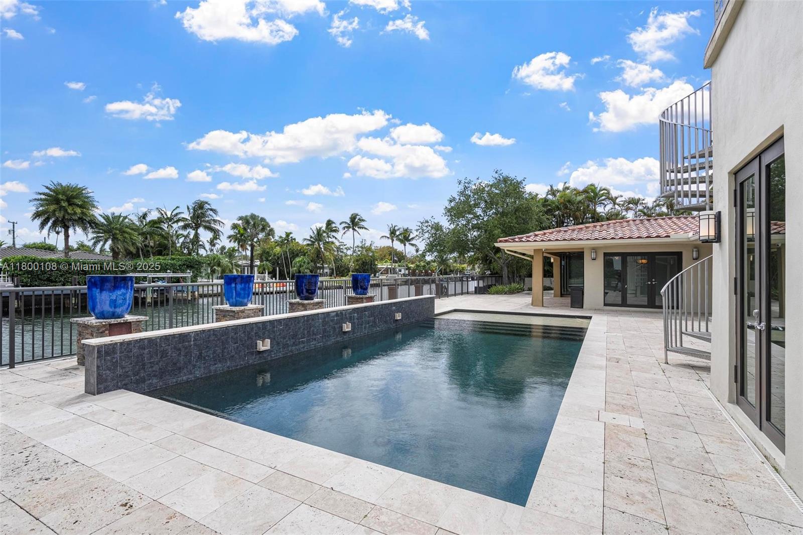 12605 Cyprus Road North Miami, FL 33181 - Photo 39 of 60 a view of a house with pool