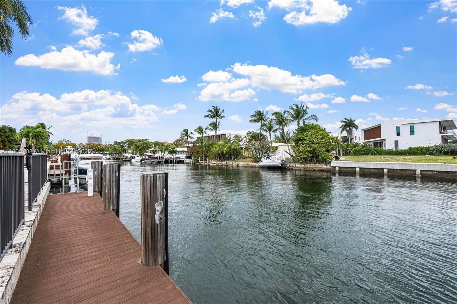 12605 Cyprus Road North Miami, FL 33181 - Photo 42 of 60 a view of a lake with a house